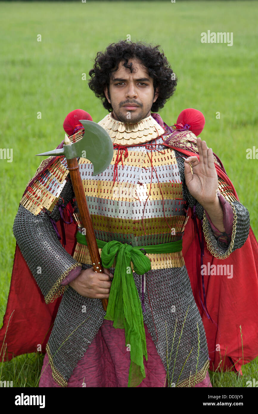 Mr Naddem Ahmed, (MR)  bearded,  23,  from Nottingham a re-enactor dressed wearing traditional historic Persian clothing & costume antiquity of a 6th Century Sassanides Iranian King in Cavalry suit.  Historical Iranian Persian costumes clothes, culture and fashion from Iran as worn by a historical Persia Iranian Royalty. From northern Iran he wears historical lamellar pattern korymbos armour, chigon, gurz-i-gawser and collar at the The 6th Tabley Cheshire Game & Country Fair held the Showground, Stock Photo