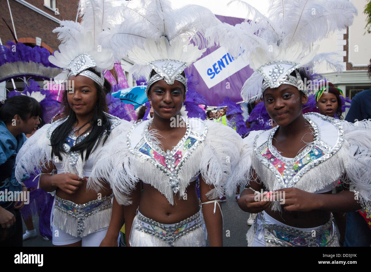 London, UK. 25th Aug, 2013. Girls march along as the annual two-day Notting Hill Carnival celebrating Afro-Carribean culture and London's ethnic diversity gets underway. Credit:  Paul Davey/Alamy Live News Stock Photo