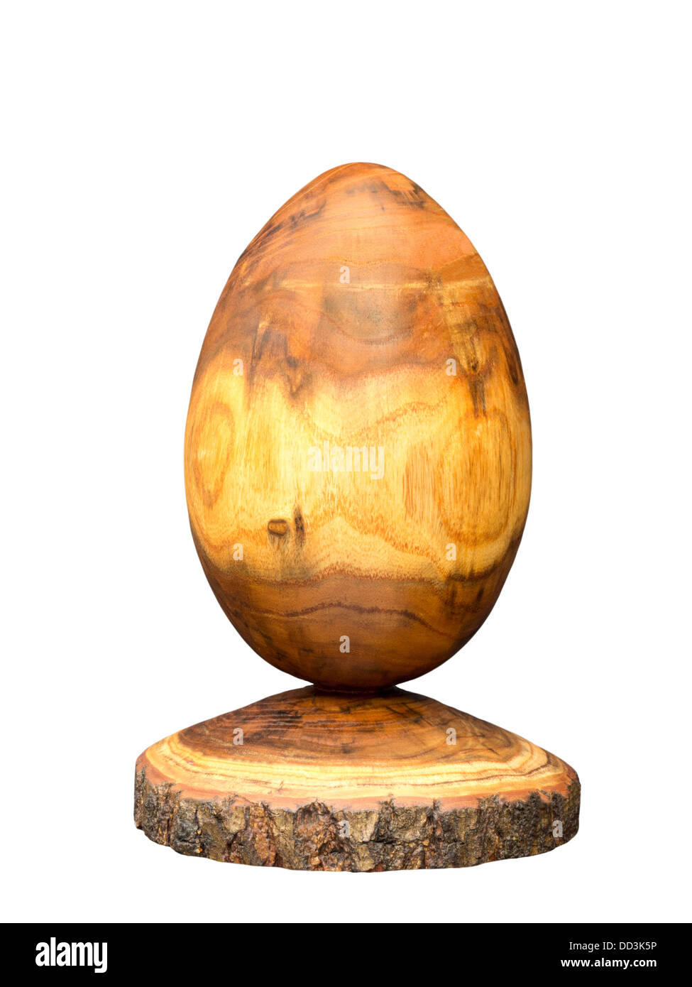 Egg made of acacia wood by means of wood turning, some bark was kept Stock Photo