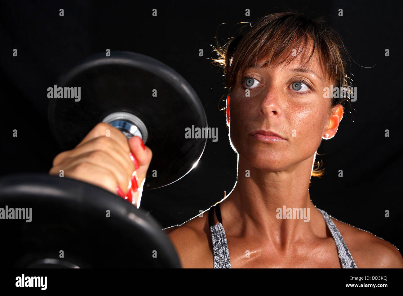 Attractive young woman working out with weights Stock Photo Alamy