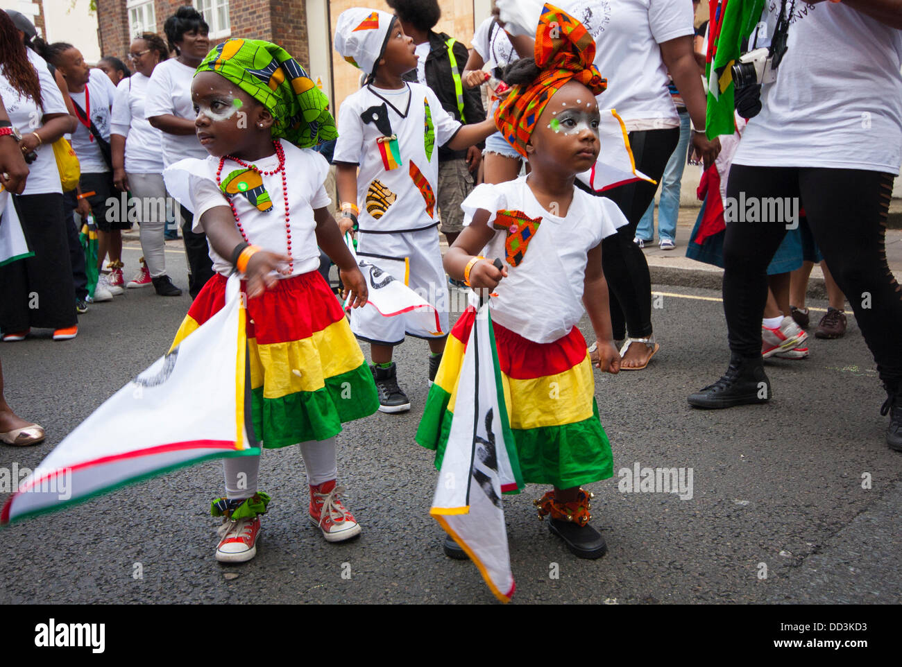 London, UK. 25th Aug, 2013. Two cute little girls i their costumes as the annual two-day Notting Hill Carnival celebrating Afro-Carribean culture and London's ethnic diversity gets underway. Credit:  Paul Davey/Alamy Live News Stock Photo