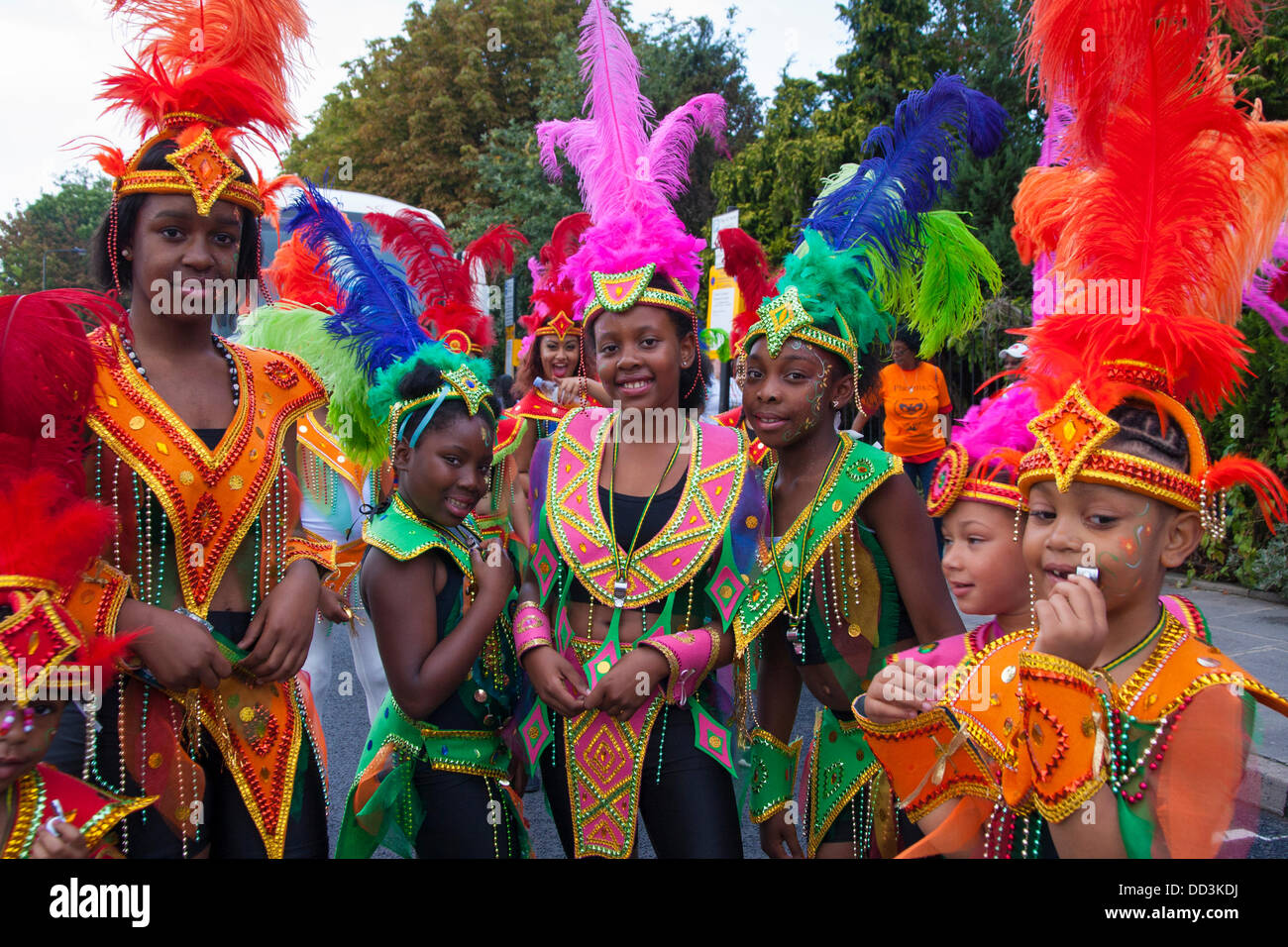 London, UK. 25th Aug, 2013. Girls wait for the procession to begin as the annual two-day Notting Hill Carnival celebrating Afro-Carribean culture and London's ethnic diversity gets underway. Credit:  Paul Davey/Alamy Live News Stock Photo