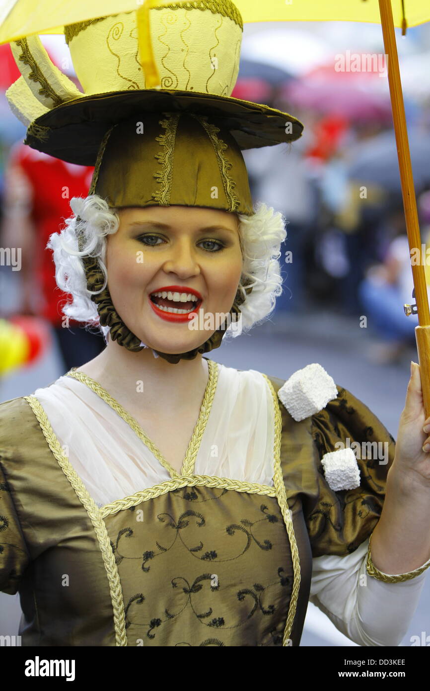Worms, Germany. 25th August 2013. A participant of the Backfischfest parade 2013 is pictured dressed in a fancy dress. The first highlight of this year's Backfischfest was the big parade through the city of Worms with over 100 groups and floats. Community groups, sport clubs, music groups and business from Worms and further afield took part. Credit:  Michael Debets/Alamy Live News Stock Photo