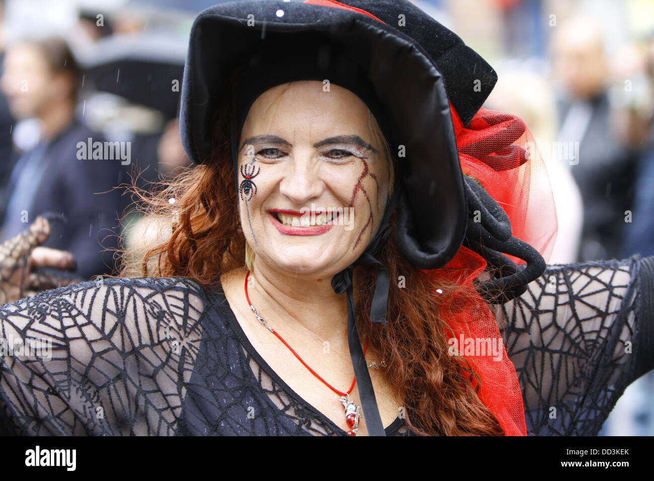 Worms, Germany. 25th August 2013. A Wissegockelhexe (witch) is pictured at the Backfischfest parade 2013. The first highlight of this year's Backfischfest was the big parade through the city of Worms with over 100 groups and floats. Community groups, sport clubs, music groups and business from Worms and further afield took part. Credit:  Michael Debets/Alamy Live News Stock Photo
