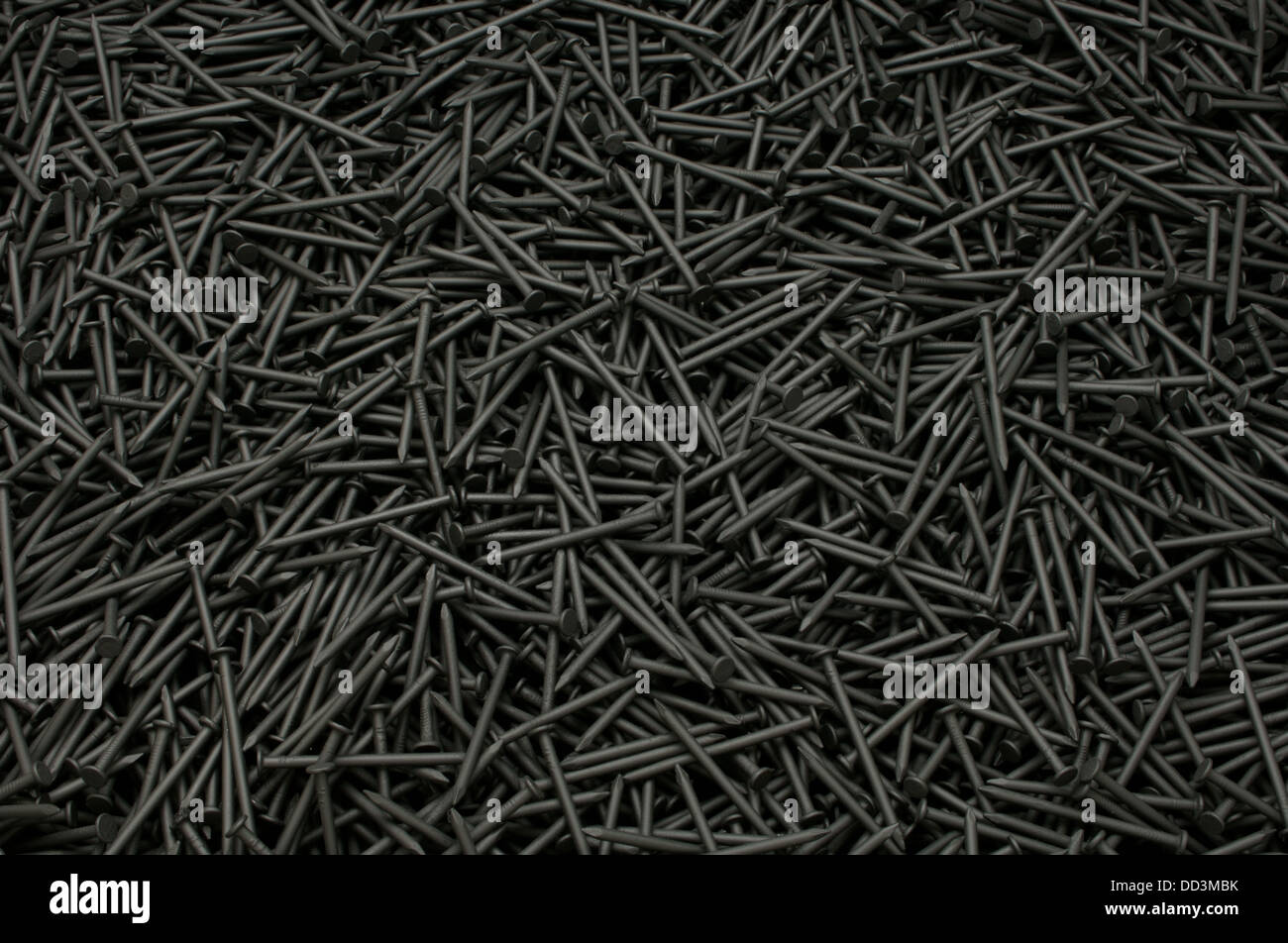 A background of black metal construction nails Stock Photo