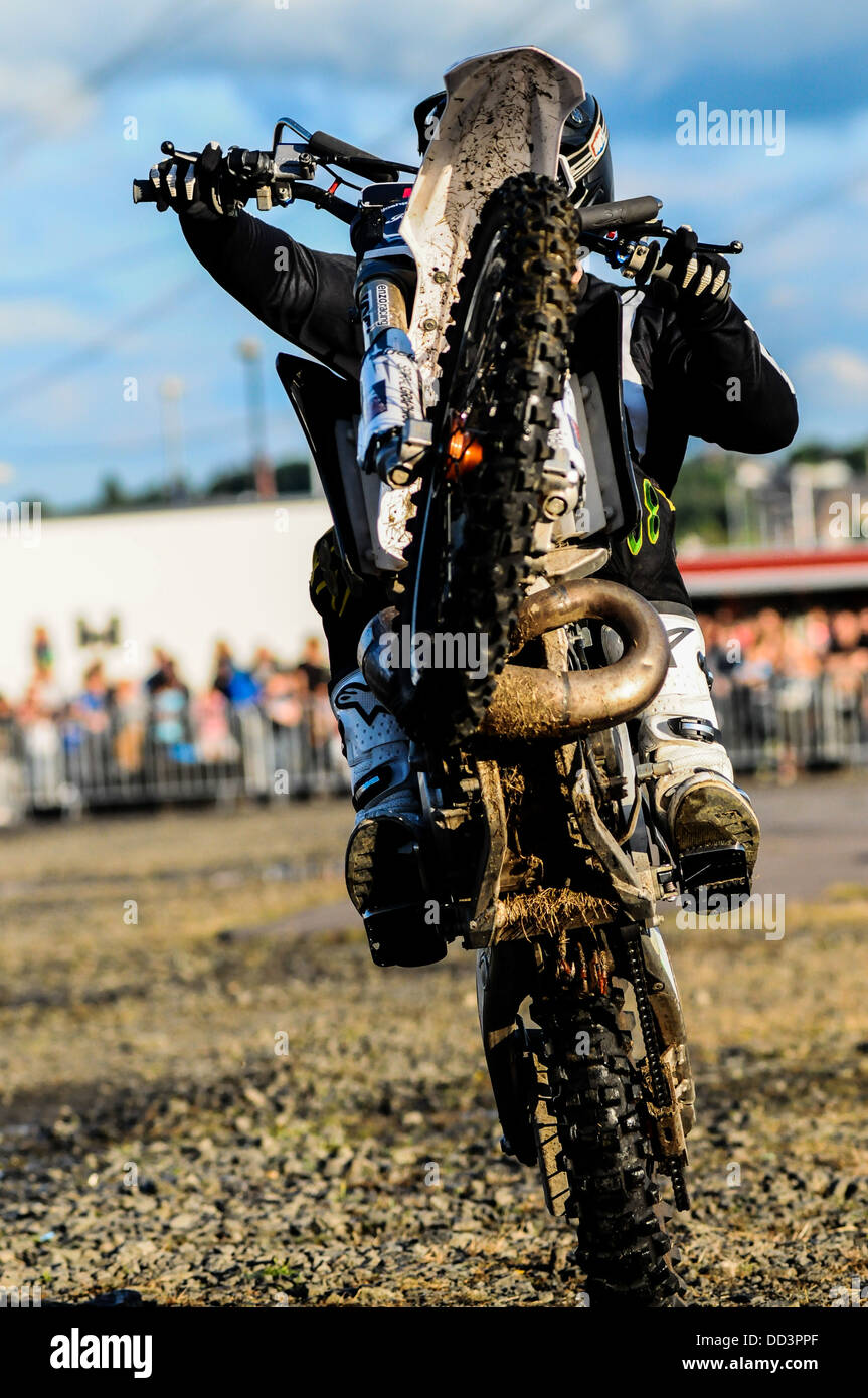 A Dirt Bike Performing A Wheelie At The Extreme Stunt Show