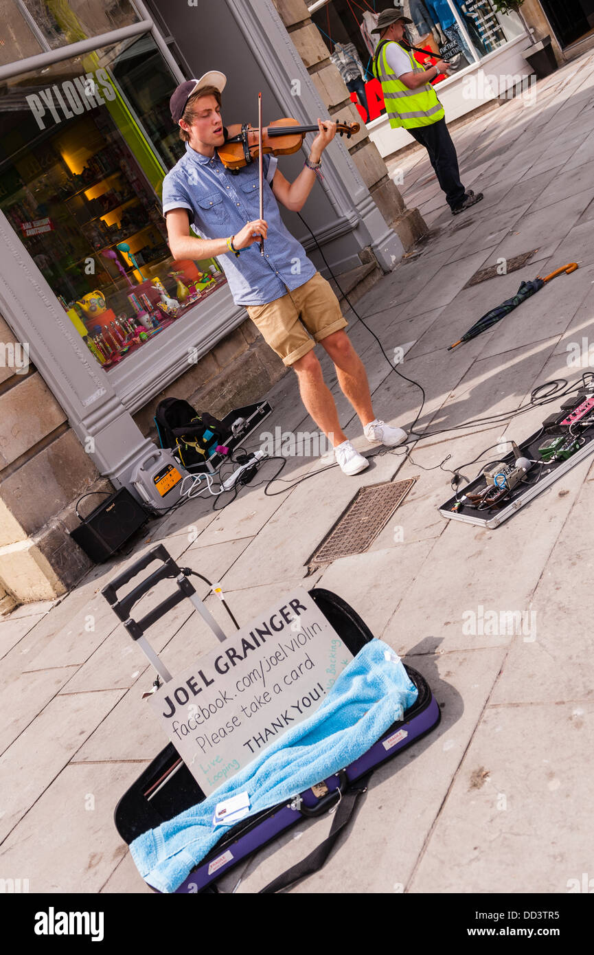 The violinist Joel Grainger busking in Bath , Somerset , England