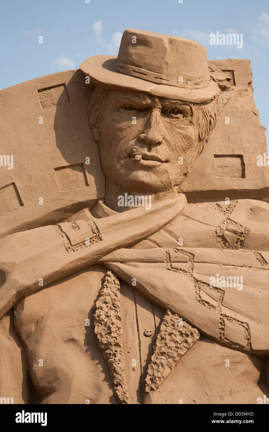 Clint Eastwood sand sculpture at the Hollywood themed Weston Sand Sculpture Festival 2013, Weston Super Mare Somerset England UK Stock Photo