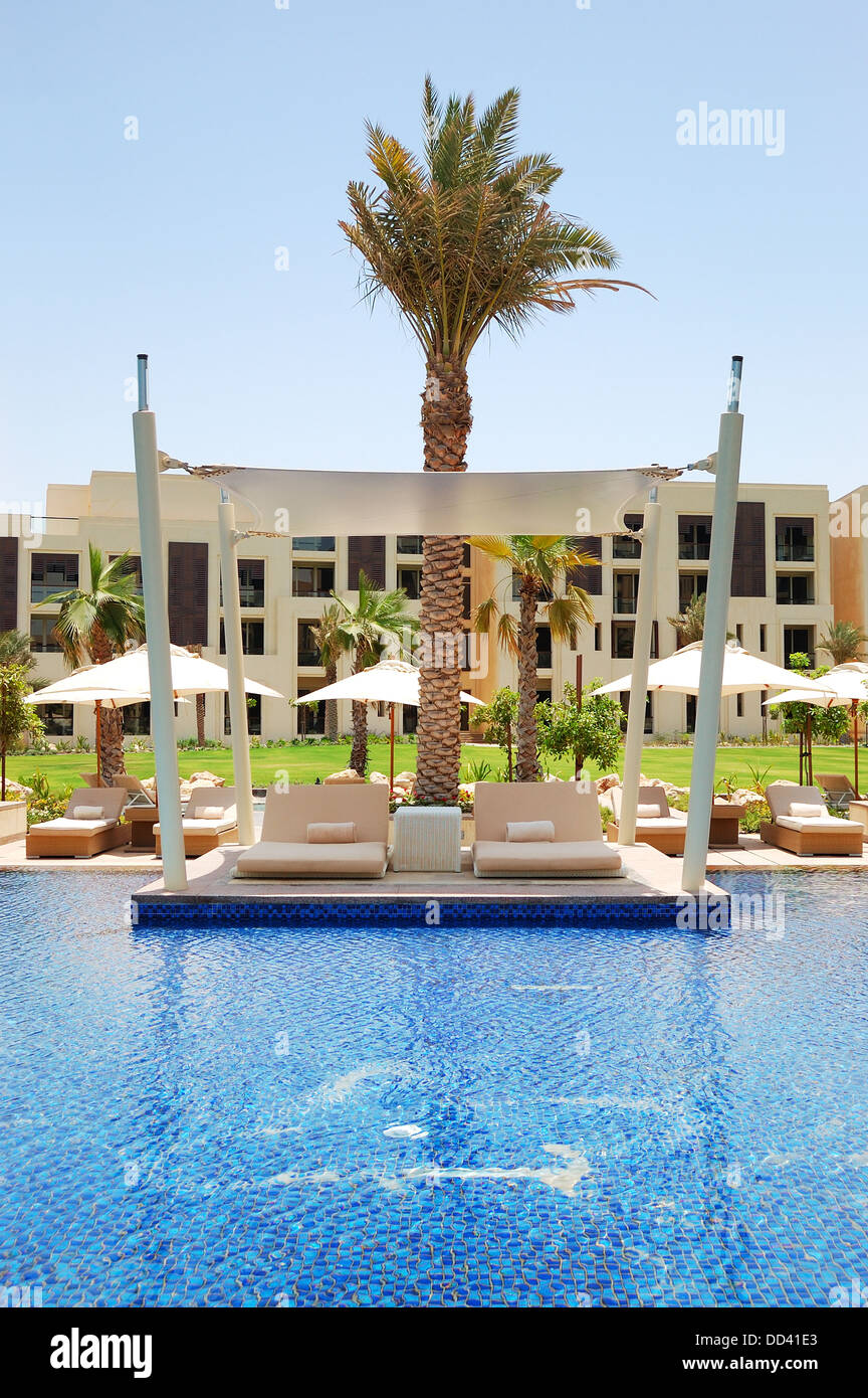 Hut at swimming pool of the luxury hotel, Saadiyat island, Abu Dhabi, UAE Stock Photo