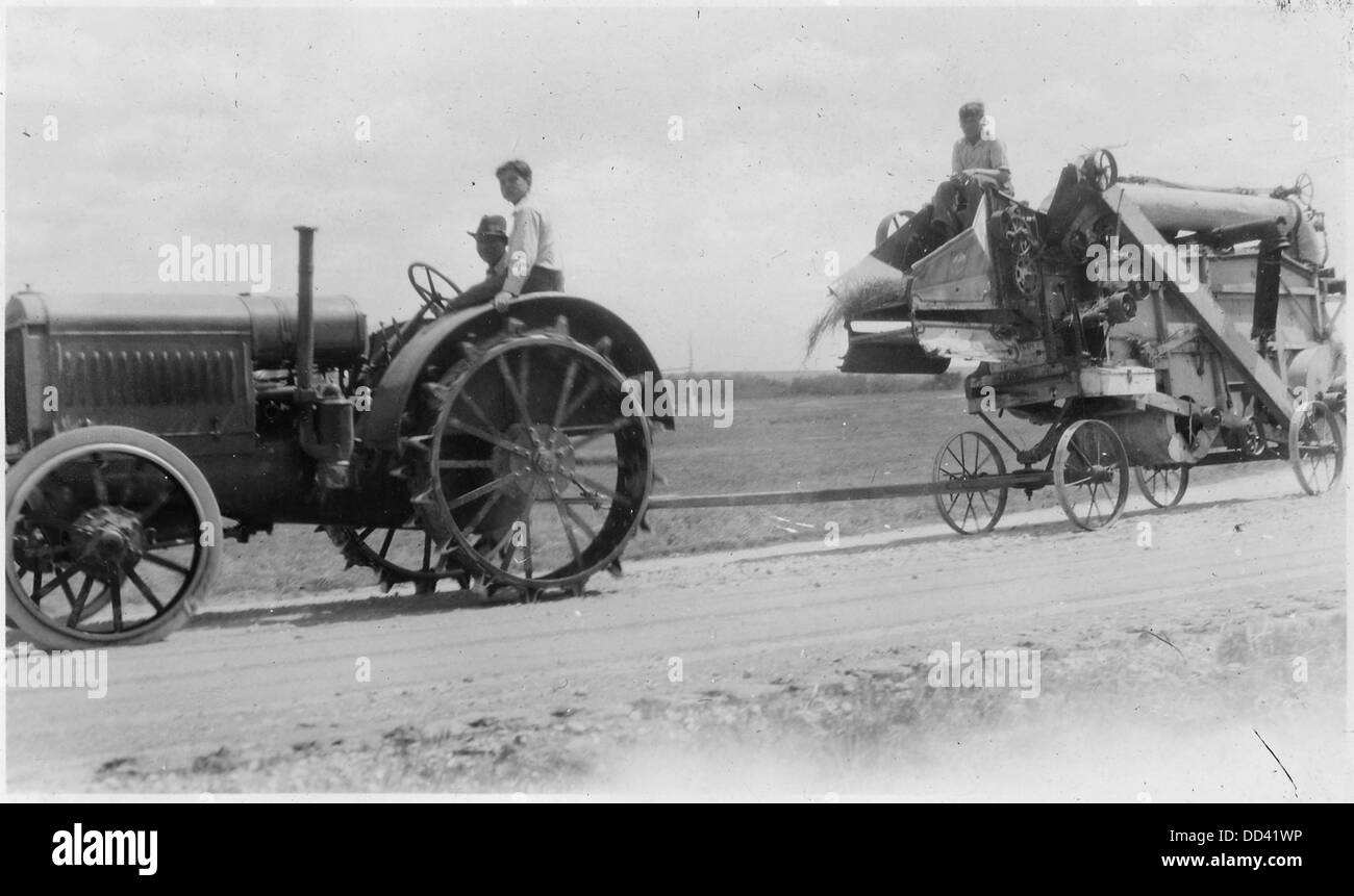 Tractor pulling farm machinery Black and White Stock Photos & Images ...