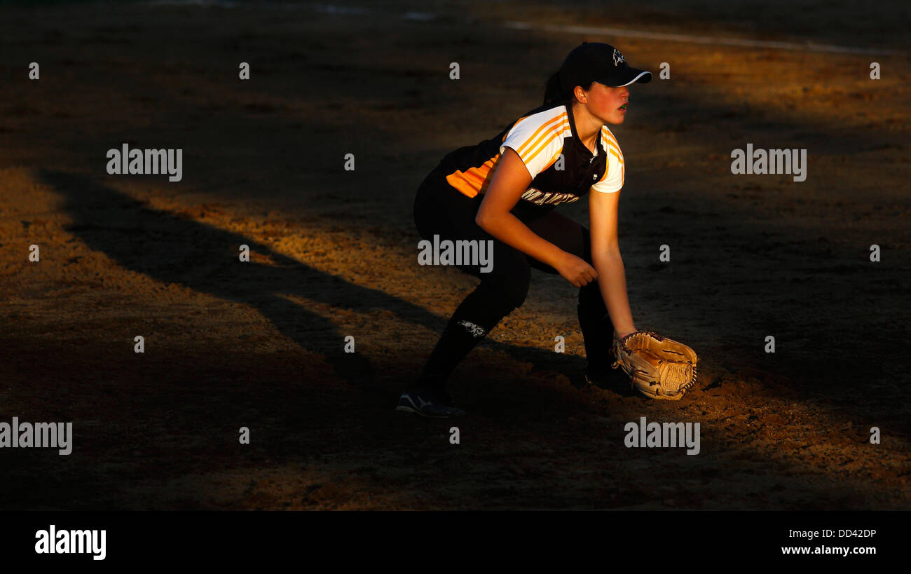 Manitoba's Makensy Payne is spotlighted by the setting sun in women's softball at the Canada Games August 5, 2013 in Sherbrooke, Stock Photo