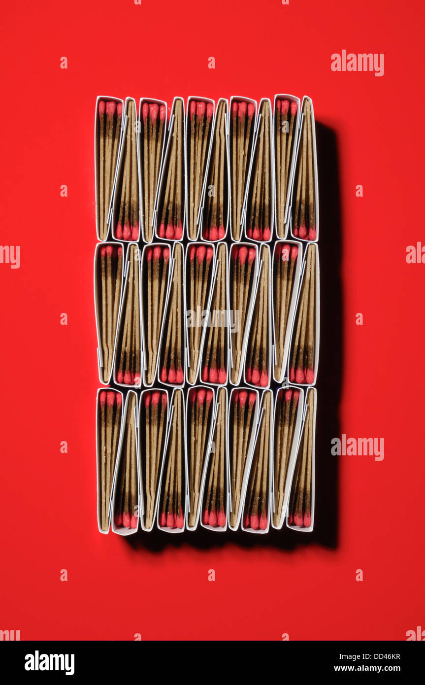 Packs of matches together forming a unique pattern. Rectangular shape, red background Stock Photo