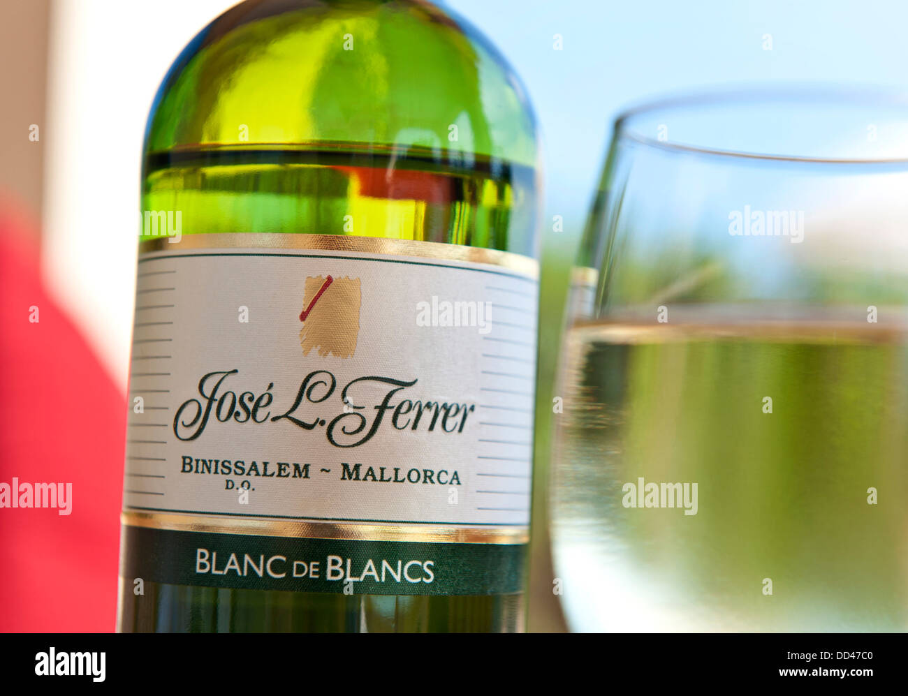 Blanc de Blanc Jose Ferrer Mallorca wine bottle and glass on alfresco terrace table Stock Photo