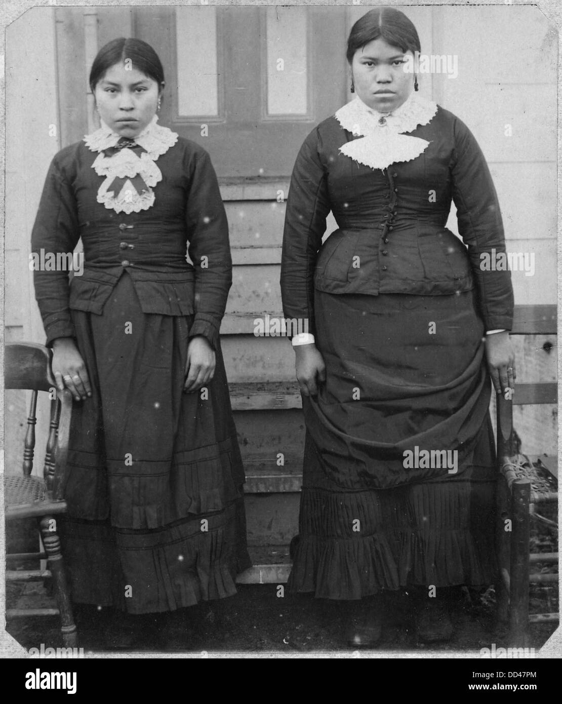 A photograph showing two young Indian women, providing insight into their cultural attire and role within their community. Stock Photo