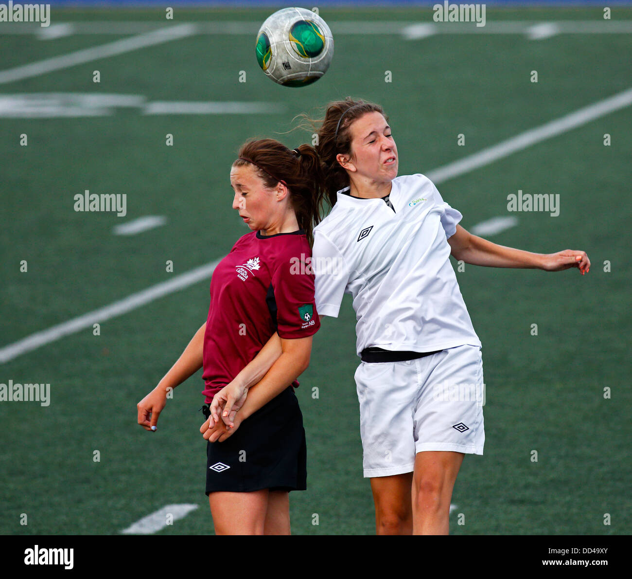 Brenna Kettlewell of New Brunswick and Danielle Younker of Prince Edward Island compete in women's soccer at the Canada Games. Stock Photo