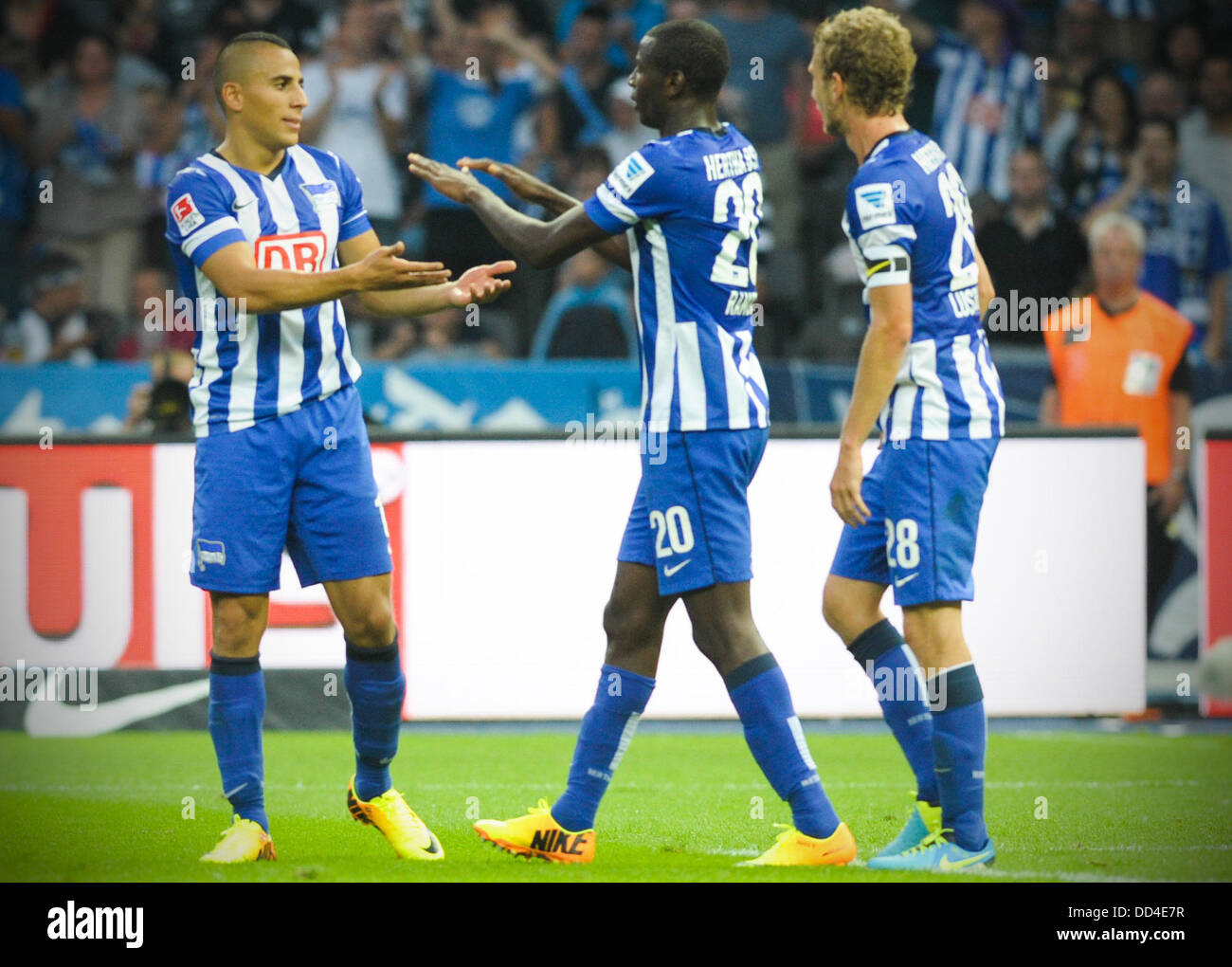 Berlin's  Anis Ben-Hatira (L) and scorer Adrian Ramos celebrate the 1-0 goal during the German Bundesliga match between Hertha BSC and Hamburger SV at the Olympiastadion in Berlin, Germany, 24 August 2013. Photo: Oliver Mehlis Stock Photo