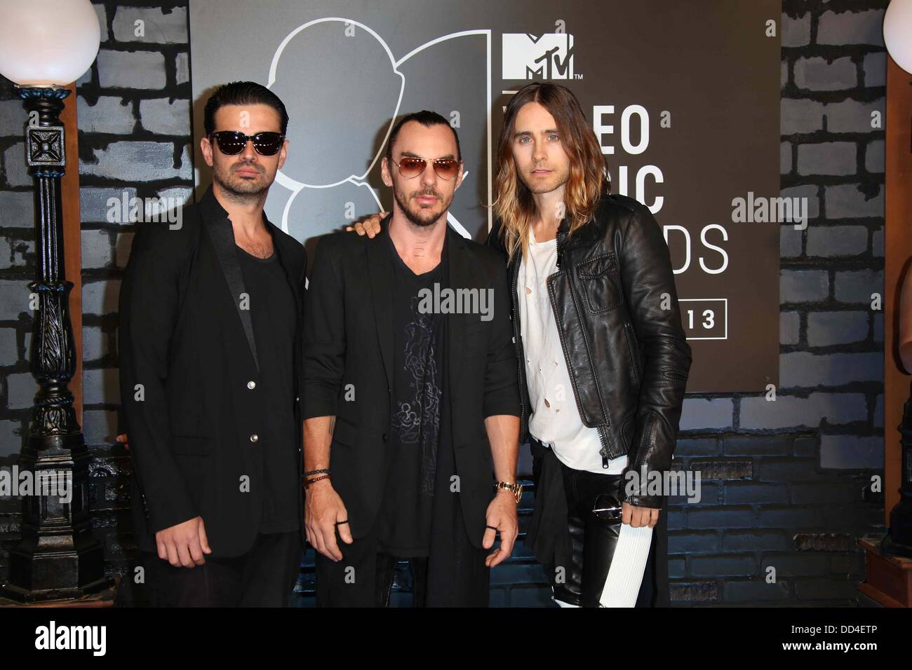 Brooklyn, New York, USA. 25th Aug, 2013. US musicians Tomislav Milicevic (l-R), Shannon Leto and Jared Leto, members of the band 30 Seconds to Mars arrive on the red carpet for the MTV Video Music Awards at the Barclays Center in Brooklyn, New York, USA, 25 August 2013. Photo: Hubert Boesl/dpa/Alamy Live News Stock Photo