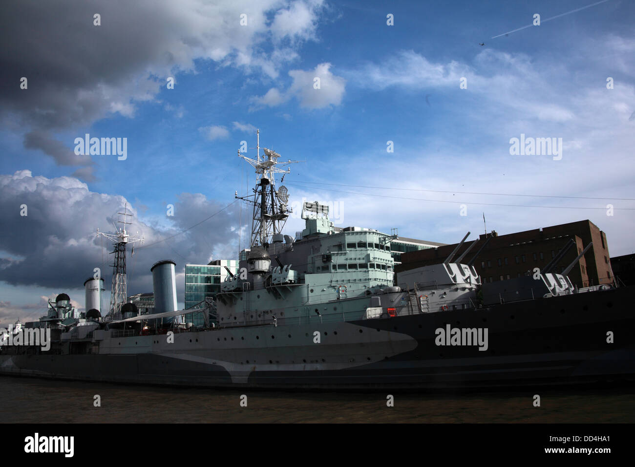 Moody image of the HMS Belfast, moored on the Thames river, London, South East England, UK Stock Photo