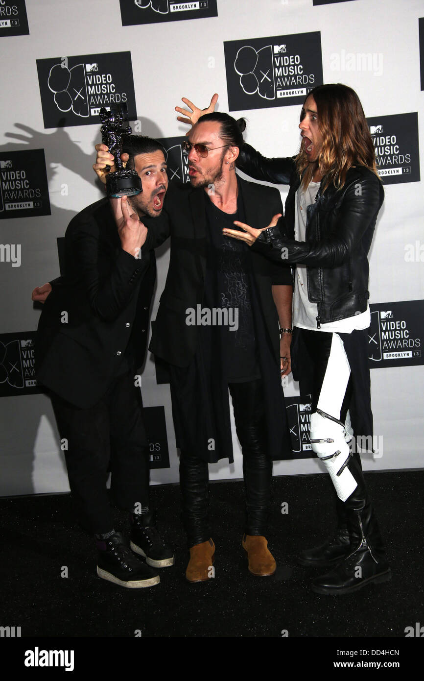 Brooklyn, New York, USA. 25th Aug, 2013. US musicians Tomislav Milicevic (l-R), Shannon Leto and Jared Leto, members of the band 30 Seconds to Mars, pose in the press room of the MTV Video Music Awards at the Barclays Center in Brooklyn, New York, USA, 25 August 2013. Photo: Hubert Boesl/dpa/Alamy Live News Stock Photo