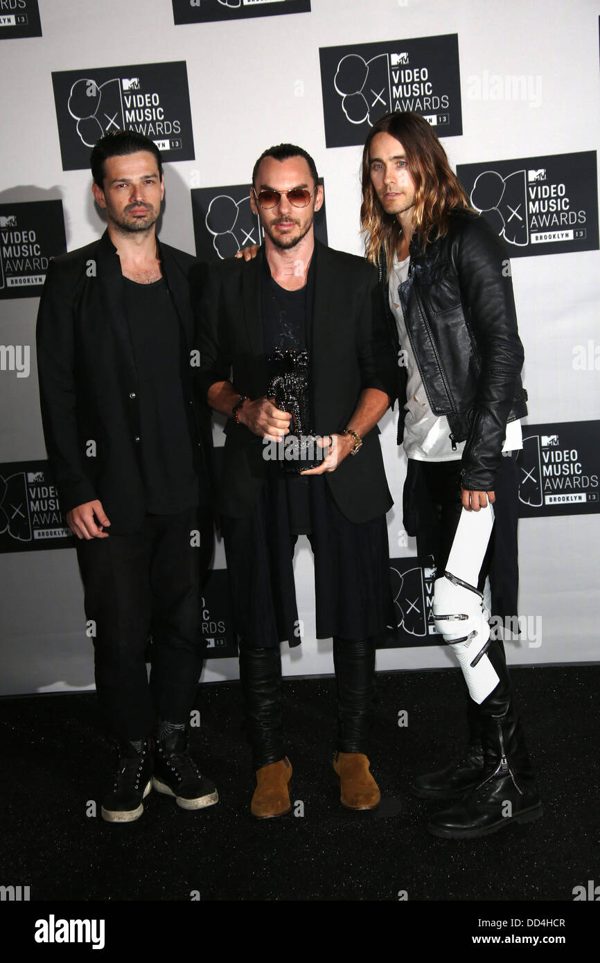Brooklyn, New York, USA. 25th Aug, 2013. US musicians Tomislav Milicevic (l-R), Shannon Leto and Jared Leto, members of the band 30 Seconds to Mars, pose in the press room of the MTV Video Music Awards at the Barclays Center in Brooklyn, New York, USA, 25 August 2013. Photo: Hubert Boesl/dpa/Alamy Live News Stock Photo