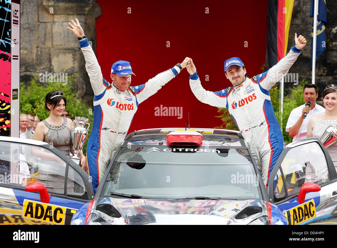 Polish rally driver Robert Kubica (R) and his co-pilot Maciej Baran cheer after winning the WRC2 event of the ADAC German Rally (Rallye Deutschland) of the of the FIA World Rally Championships near Trier, Germany, 25 August 2013. Photo: THOMAS FREY Stock Photo