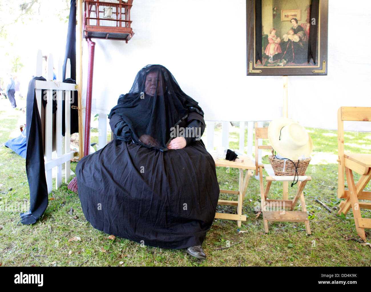 A civil war enthusiast is dresses as a widow during a civil war reenactment. Stock Photo
