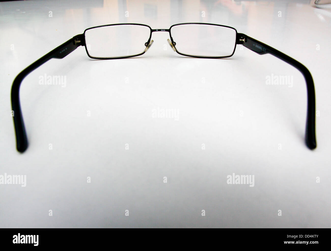Gents spectacles on table top Stock Photo