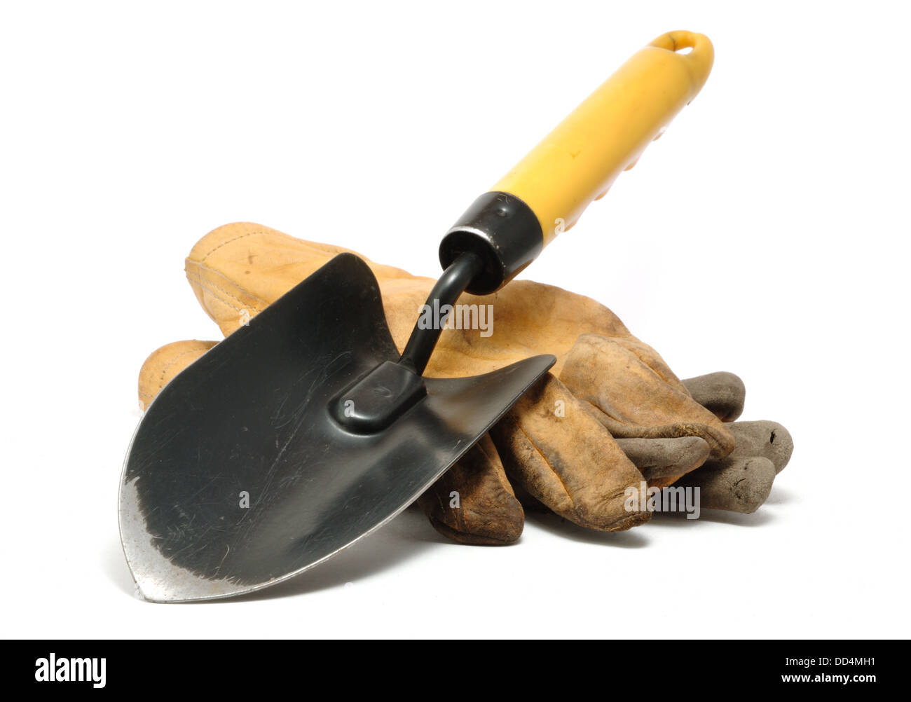 Old Dirty Leather Work Gloves and Trowel Isolated On White Stock Photo