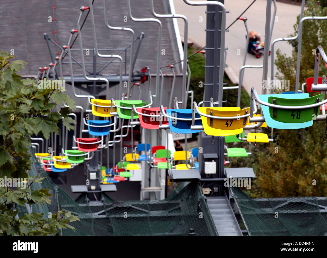 Cable Car with seats in different colors, bringing visitors from lower
