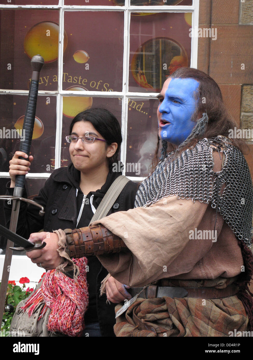 Street Actor on Castlehill, Edinburgh as Scottish Medieval Soldier during Edinburgh Fringe Festival, Scotland, UK Stock Photo