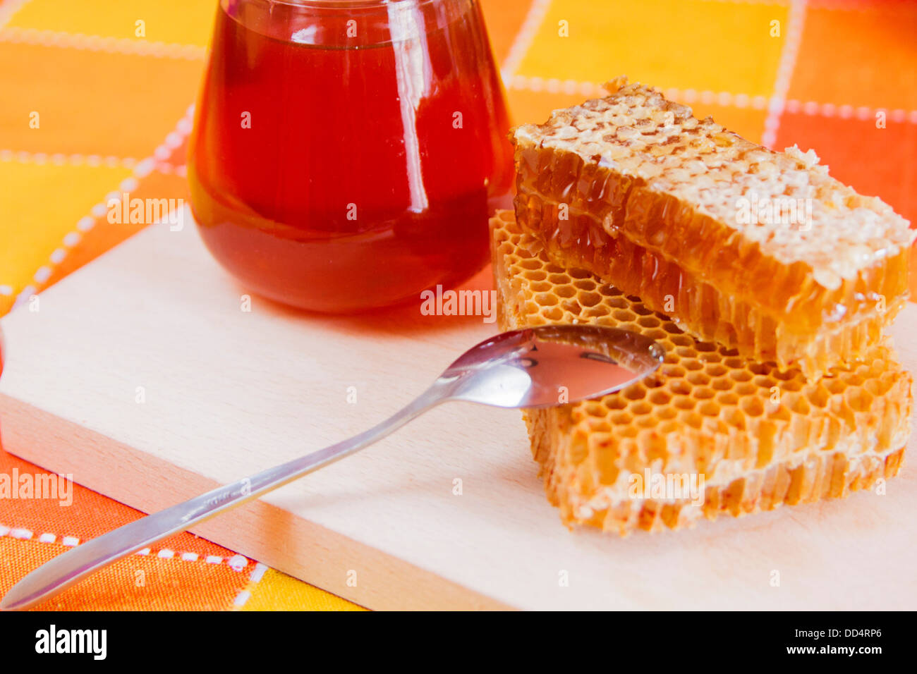 Honey jar and closeup full of honey Stock Photo Alamy