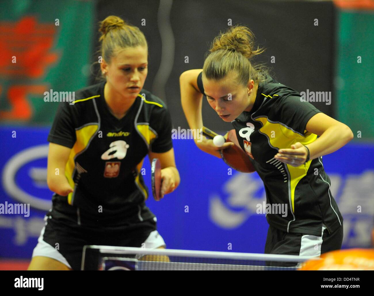 Katarzyna Grzybowska (right) and Natalia Partyka (left) of Poland in action during the finals of women's doubles against Linda Creemers and Li Jiao from Netherlands during the World Tour tournament in Olomouc, Czech Republic, August 25, 2013. (CTK Photo/Ludek Perina) Stock Photo