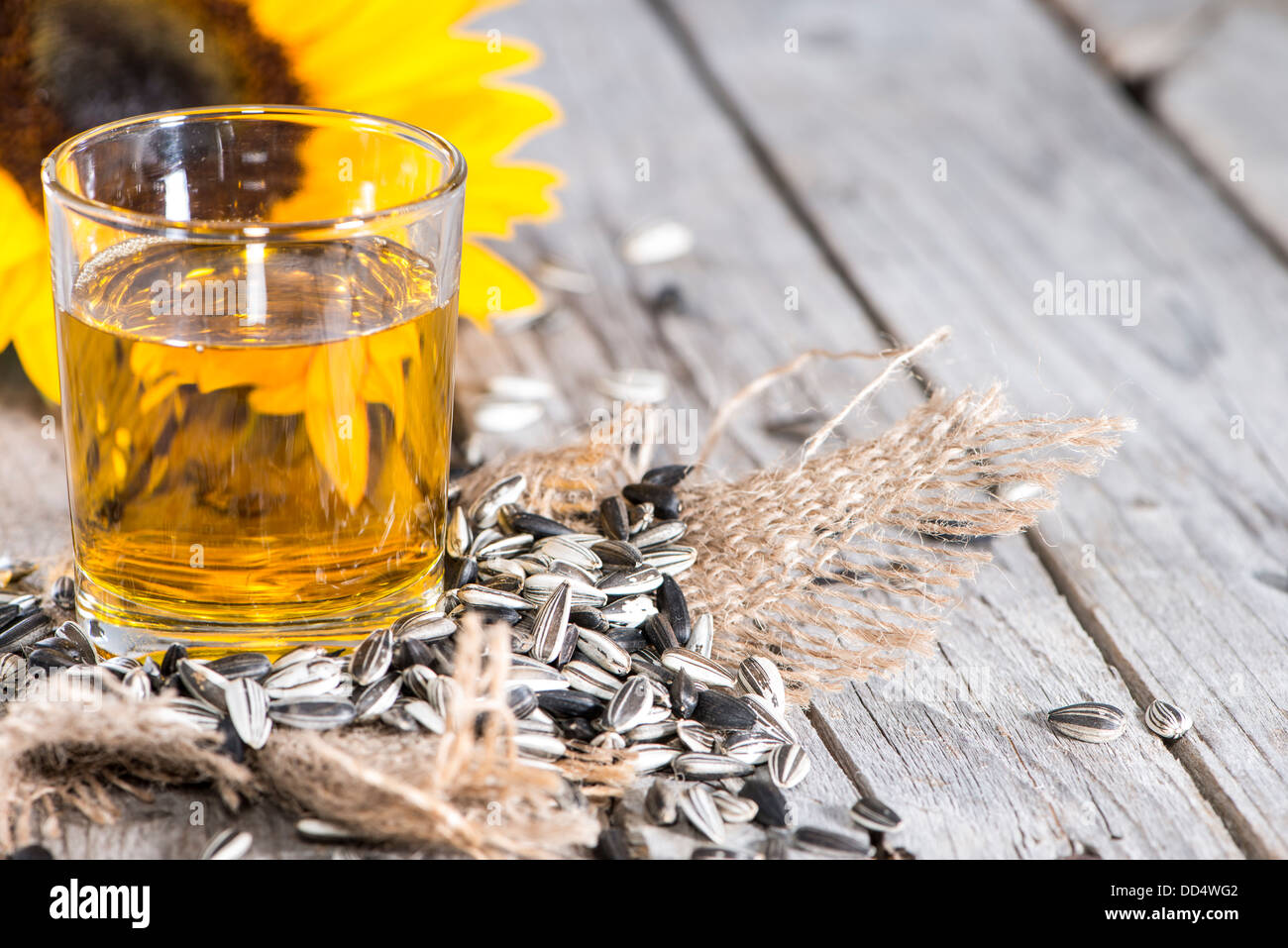 Fresh Sunflower Oil on wooden background Stock Photo