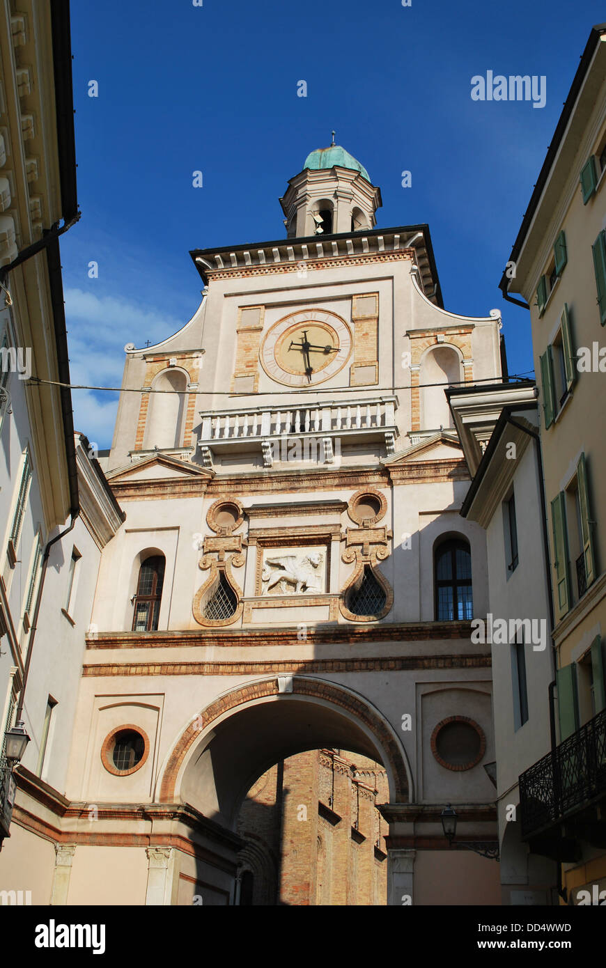 Ancient houses and clock arch entrance to cathedral square, Crema town