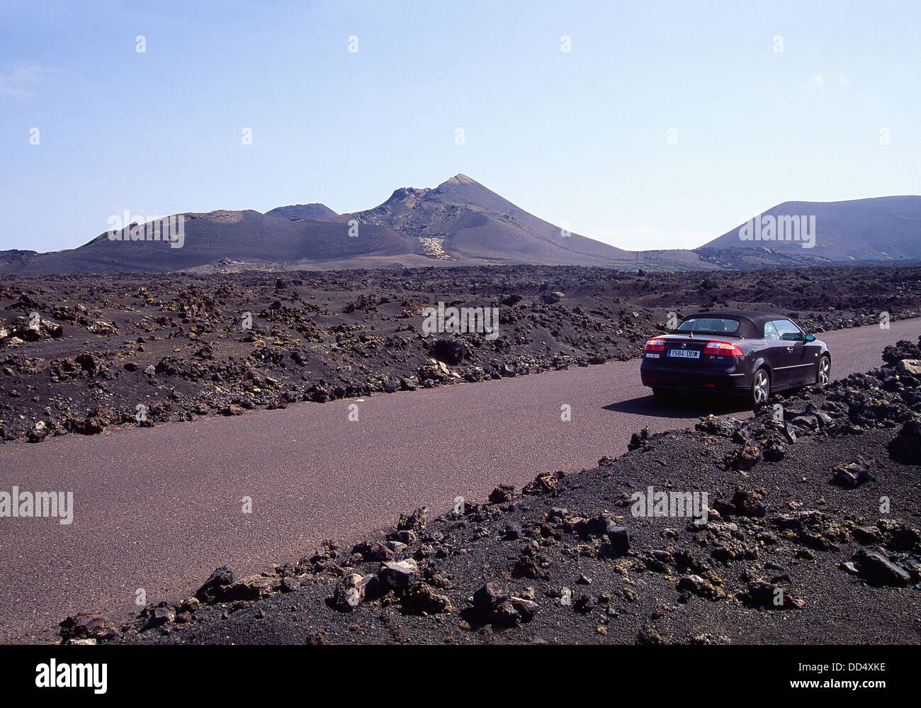 Car stopped on road. Timanfaya National Park, Lanzarote island, Canary Islands, Spain. Stock Photo