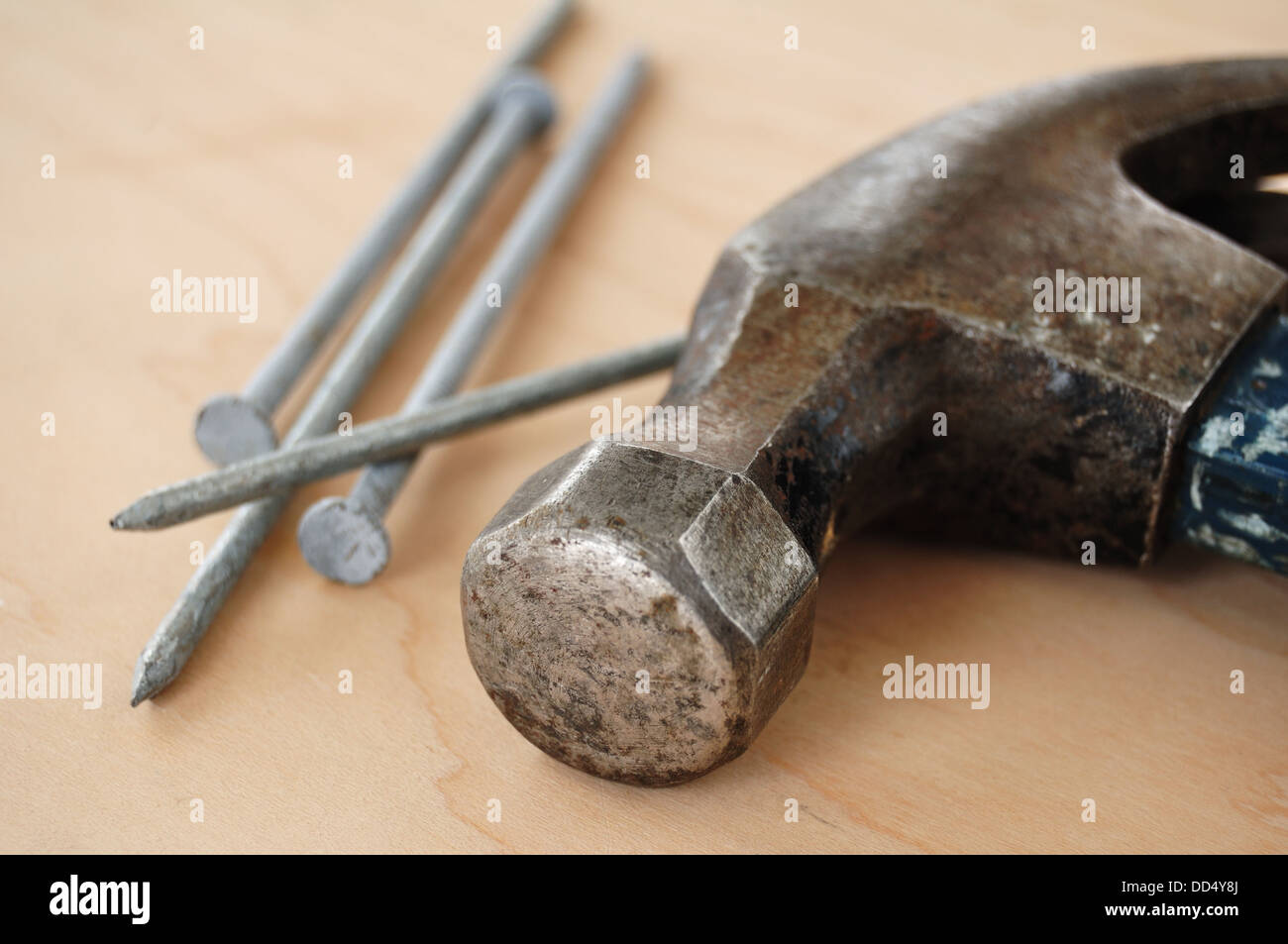 Galvanized Nails and a Claw Hammer Stock Photo