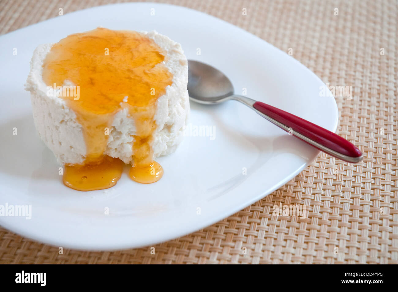 Curd cheese with honey. Close view. Stock Photo