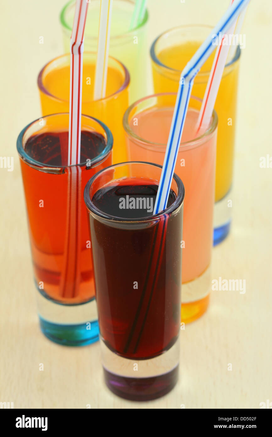 Refreshments, fruit drinks and juices in little glasses Stock Photo