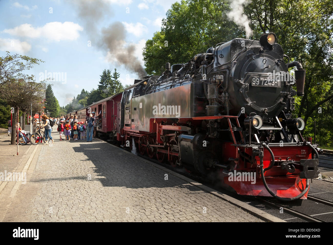 Steam train at Drei Annen Hohne with tourists boarding, Saxony Anhalt, Germany Stock Photo
