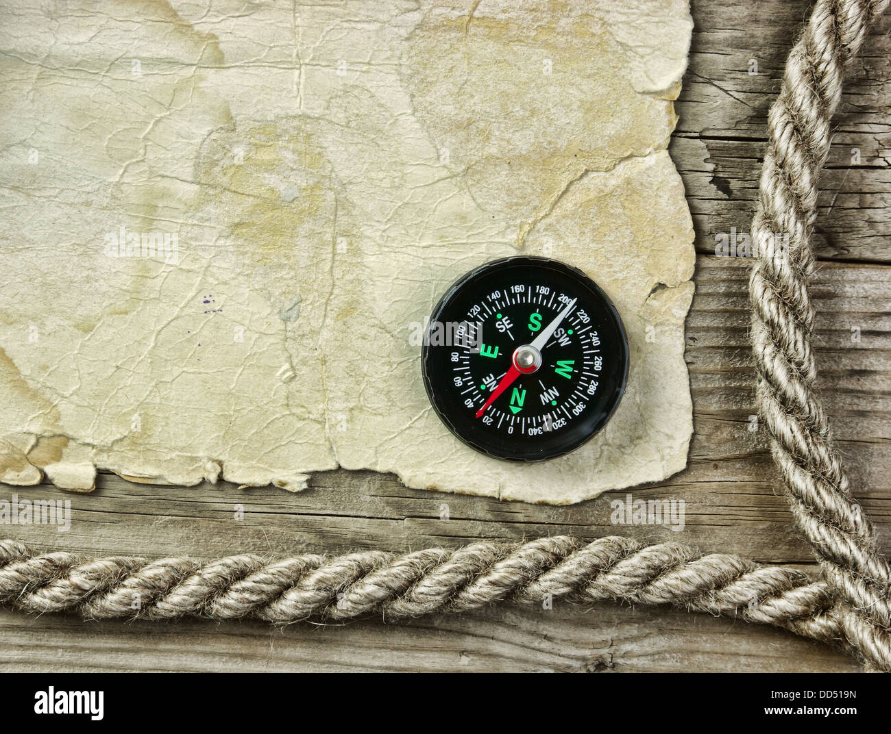 Vintage paper with compass and rope on old wooden boards Stock Photo ...