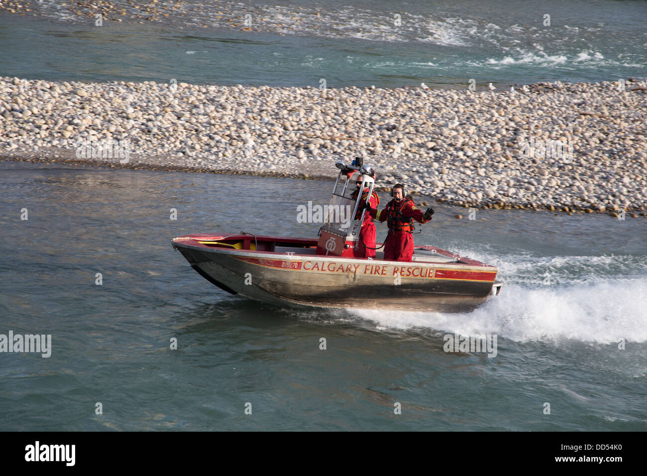Fire-department rescue boat in the Bow River Stock Photo