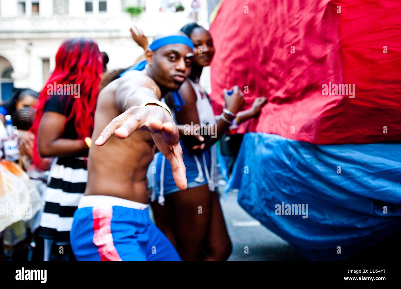 London, UK - 26 August 2013: a man dances for the camera during the annual parade at the Notting Hill Carnival. Stock Photo