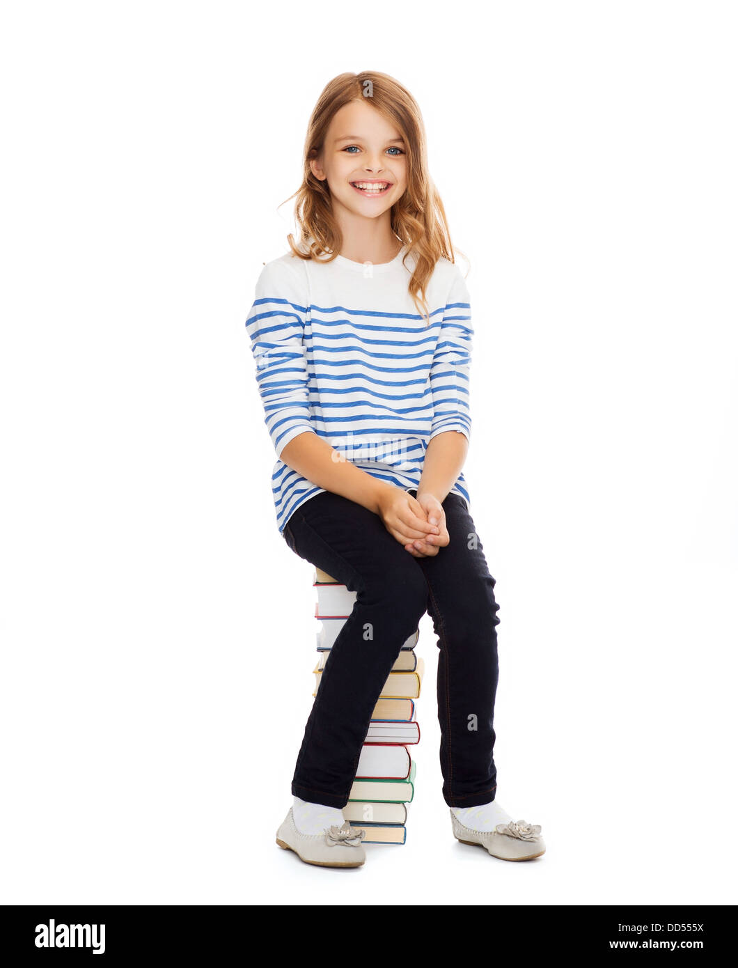 little student girl sitting on stack of books Stock Photo - Alamy