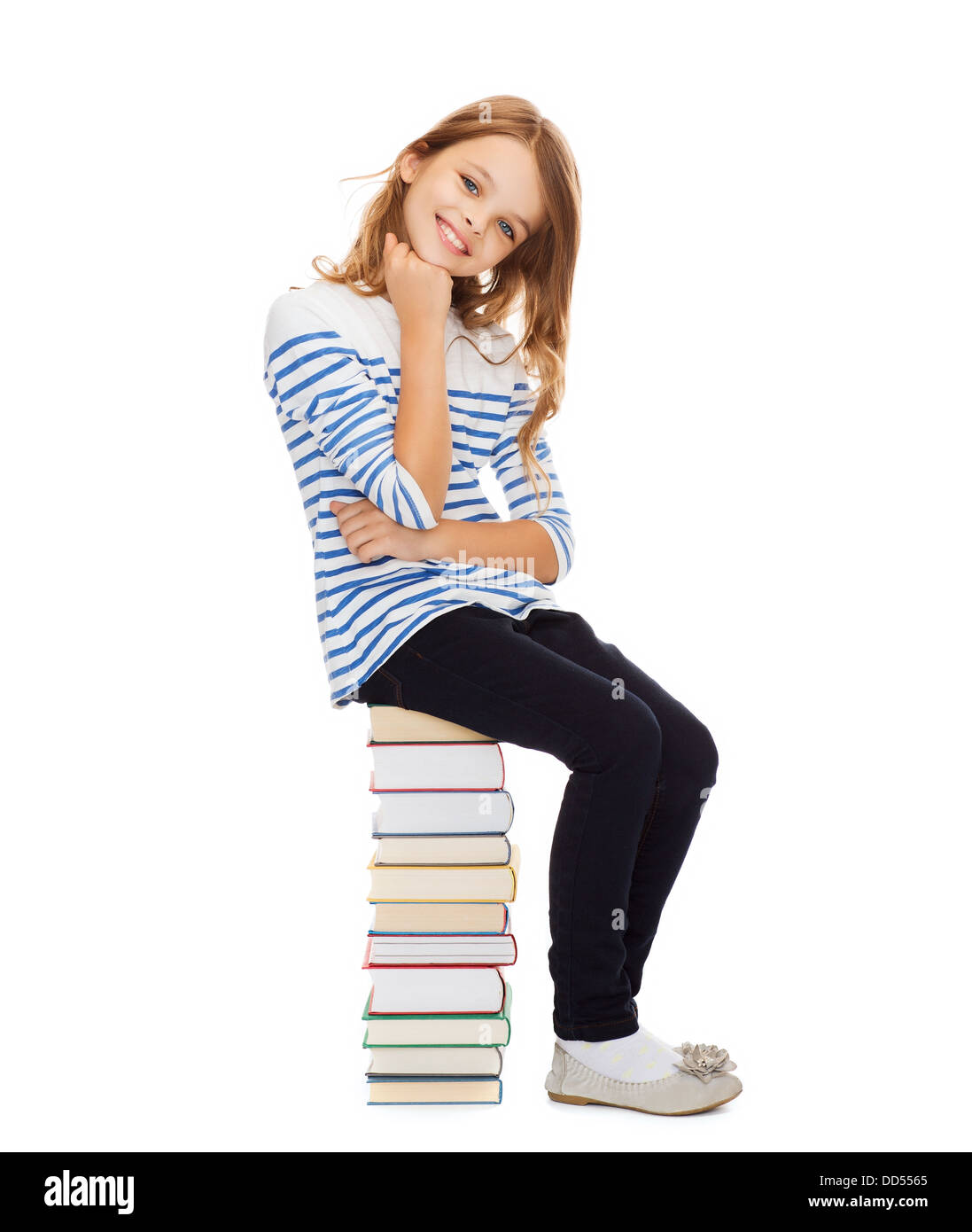 little student girl sitting on stack of books Stock Photo - Alamy