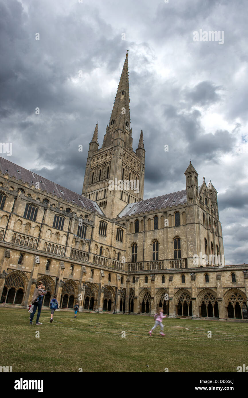 Norwich cathedral from the cloisters with a family playing on the Labyrinth Stock Photo