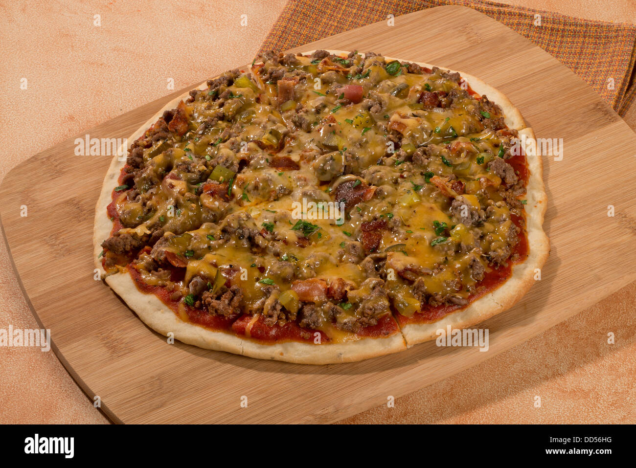Cheeseburger Pizza cut and ready to serve. Stock Photo