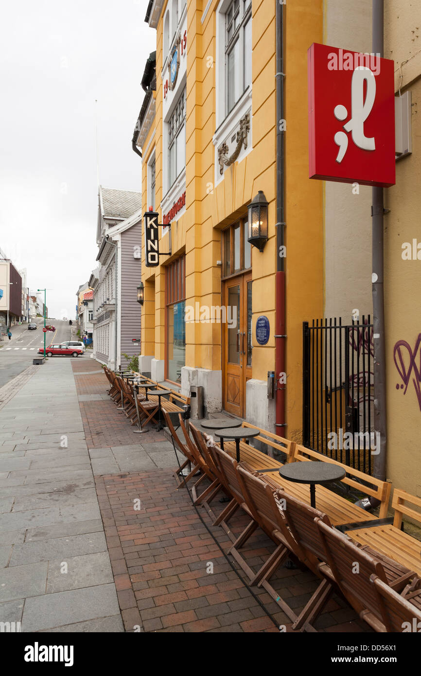 Old cinema building in Tromso with street cafe Stock Photo