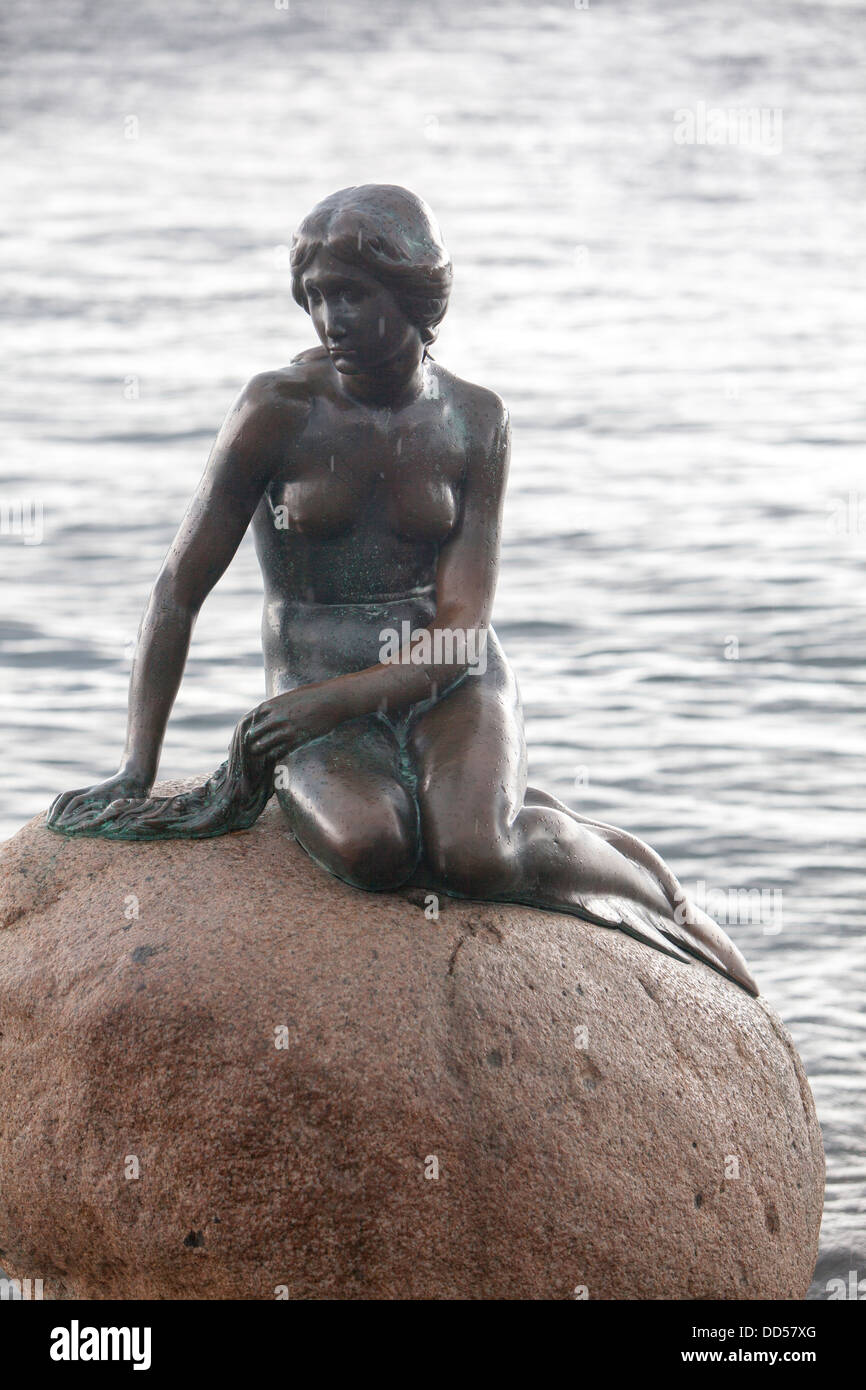 The Little Mermaid bronze statue, displayed on a rock by the waterside at the Langelinie promenade in Copenhagen, Denmark Stock Photo