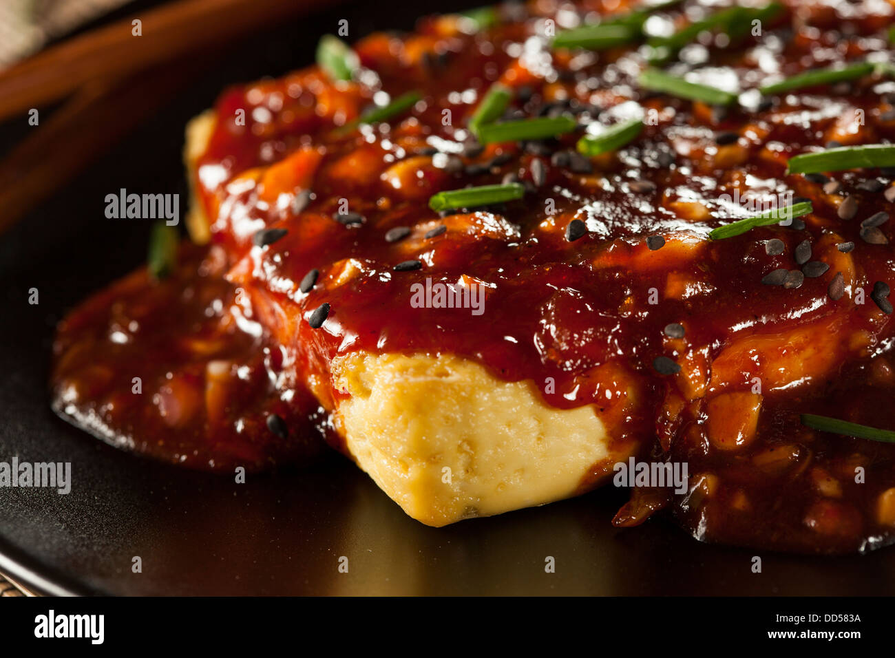 Healthy Organic Grilled Tofu with Spicy Garlic Sauce and Chives Stock