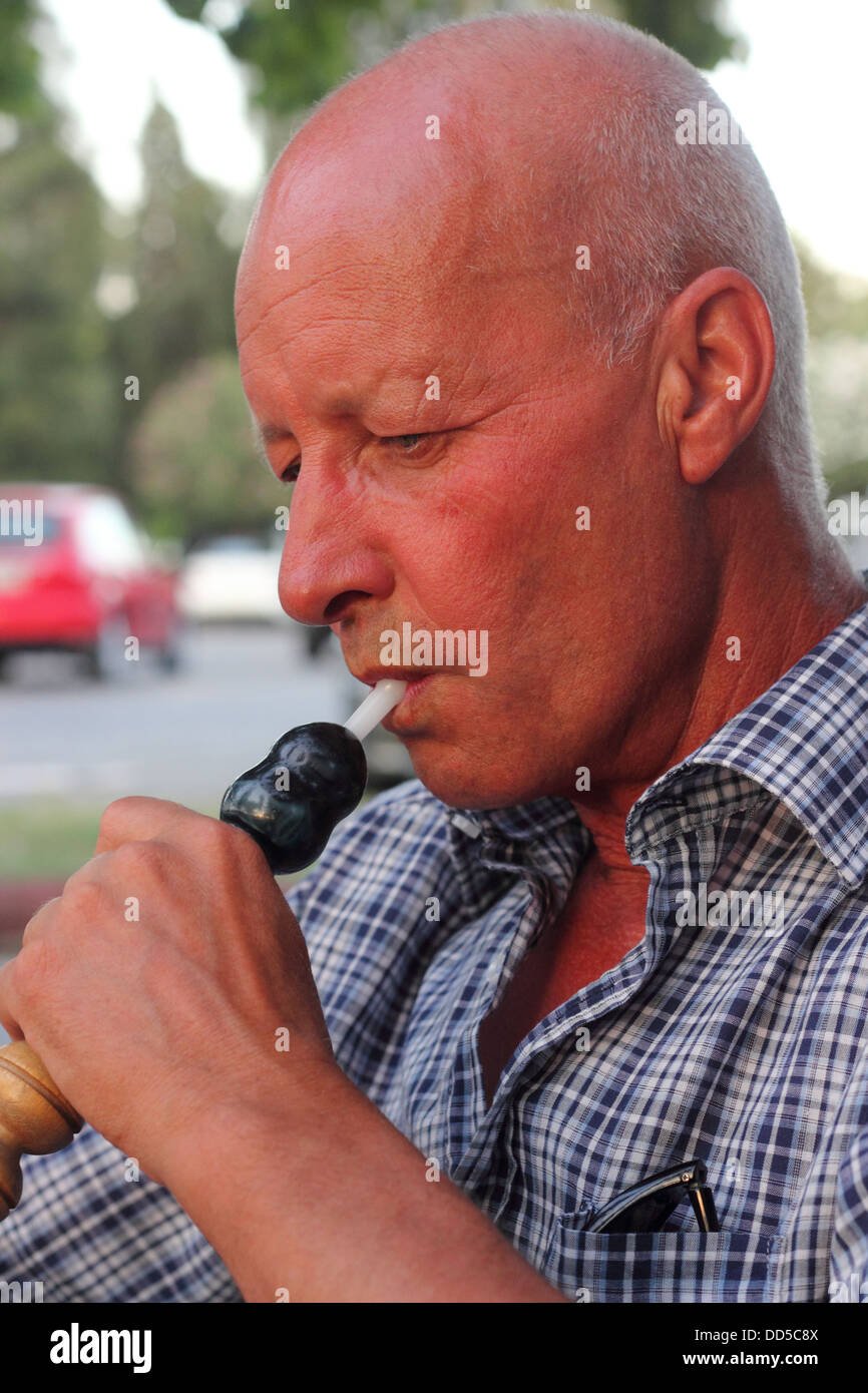 smoking a hookah waterpipe,culture Stock Photo Alamy